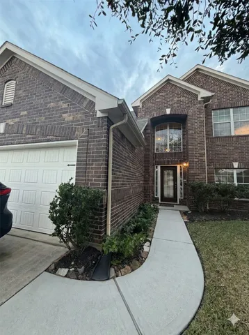 front view of a house with potted plants