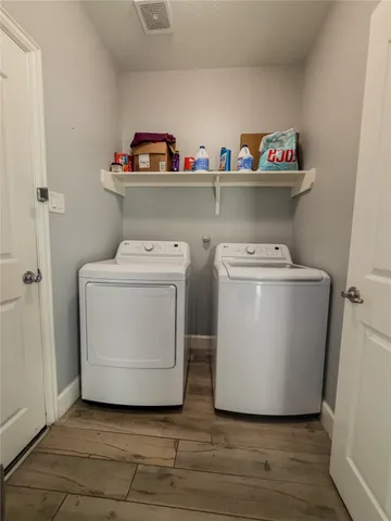a utility room with washer and dryer