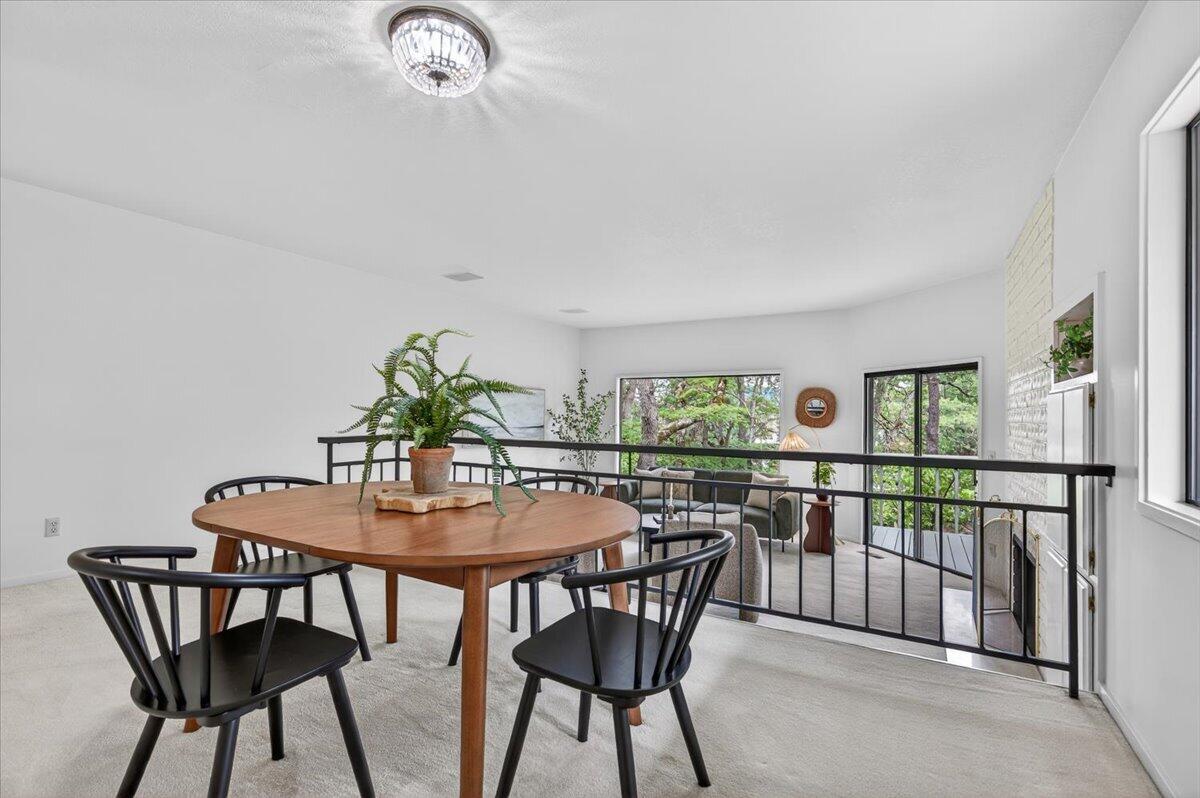 2647 Freedom Way Medford, OR 97504 - Photo 13 of 38 a view of a dining room with furniture and a potted plant