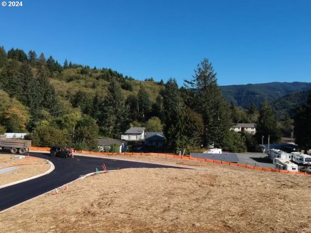 501 Garibaldi Avenue, Unit 3 Garibaldi, OR 97118 - Photo 17 of 27 a view of outdoor space with swimming pool and trees