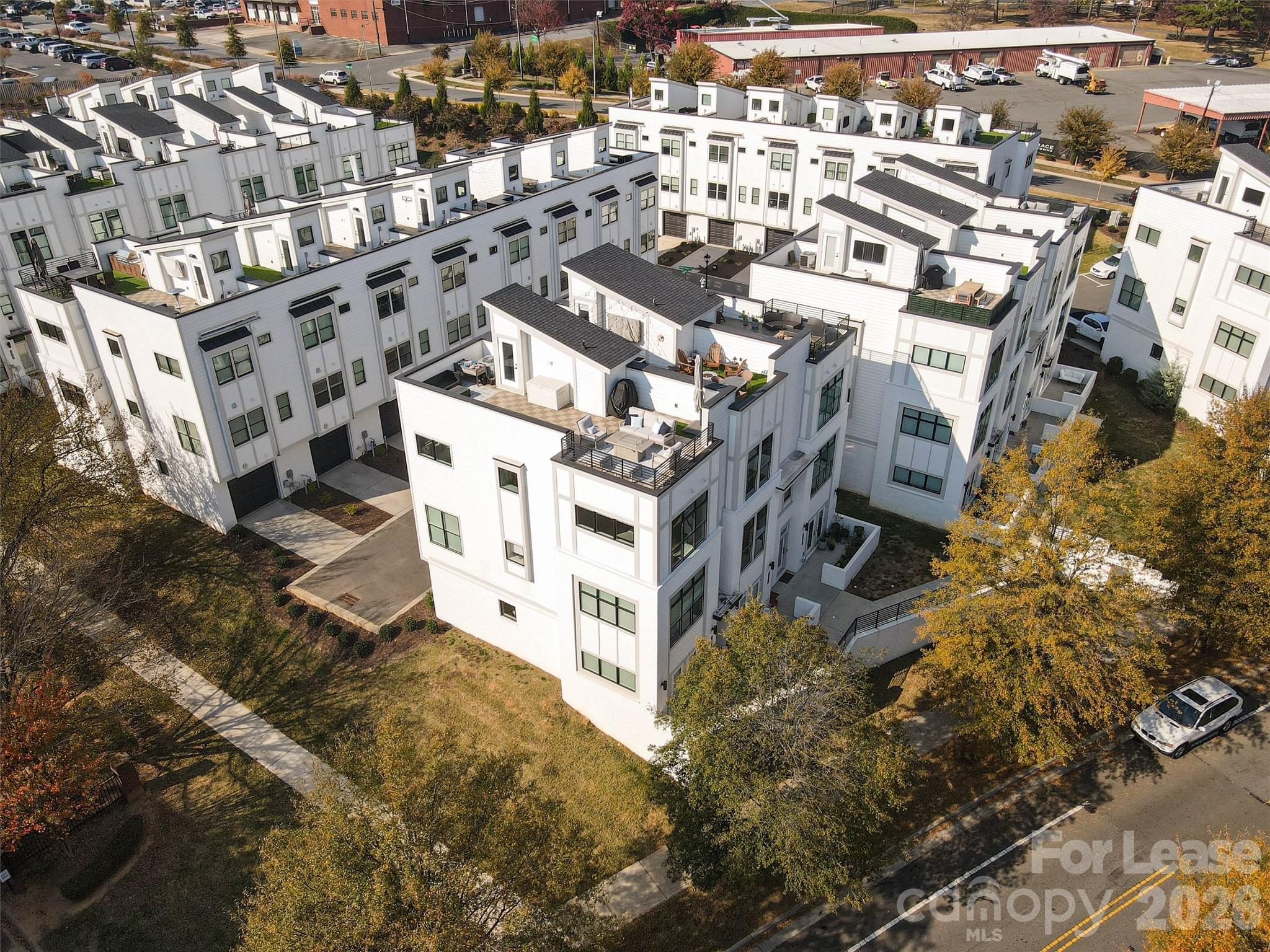 2319 Wesley Village Road Charlotte, NC 28208 - Photo 42 of 44 a large building with a view of a big yard