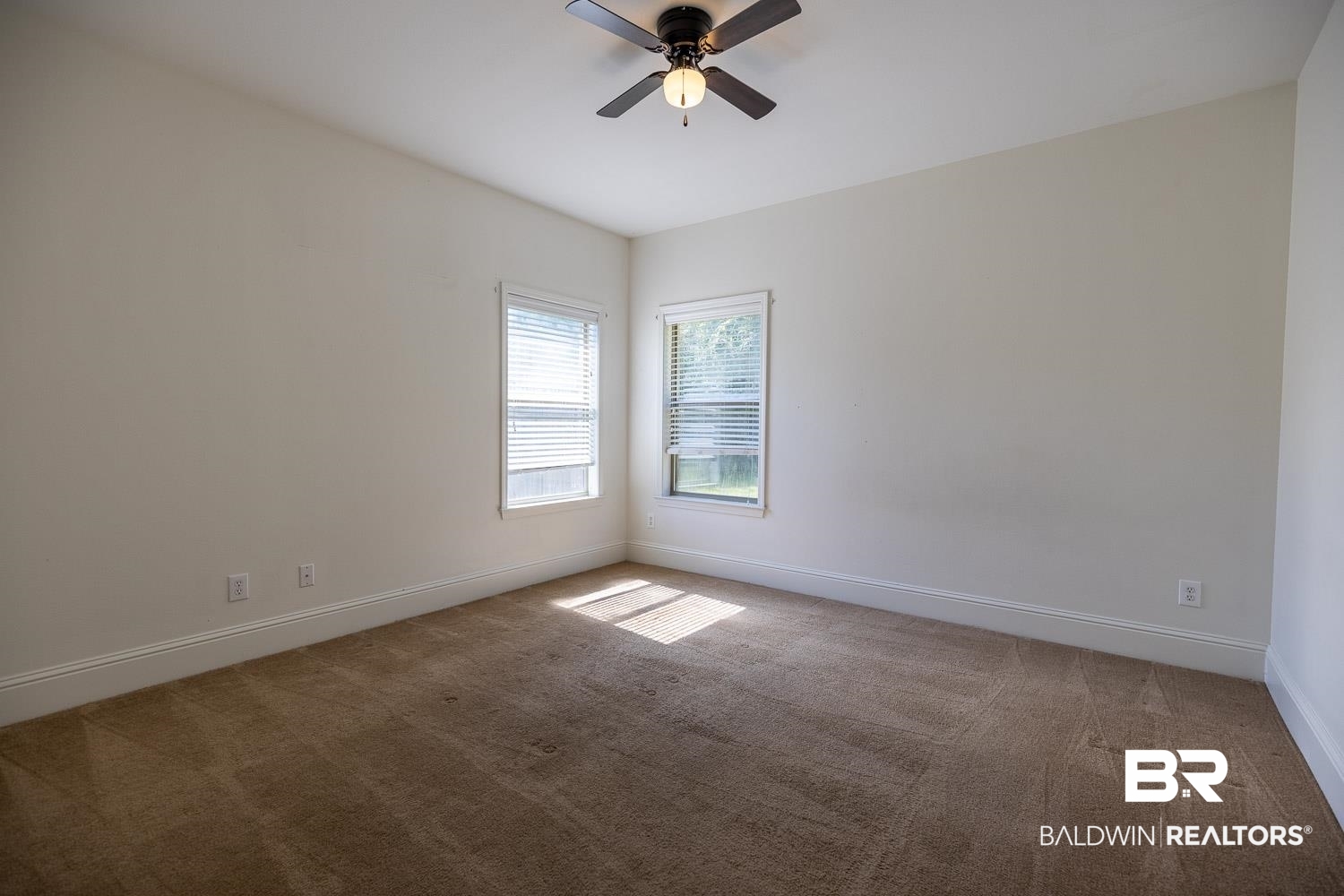 101 Normandy Street Fairhope, AL 36532 - Photo 14 of 18 Unfurnished room with light colored carpet and a ceiling fan