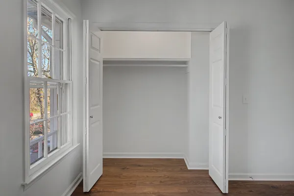 a view of an entryway with wooden floor