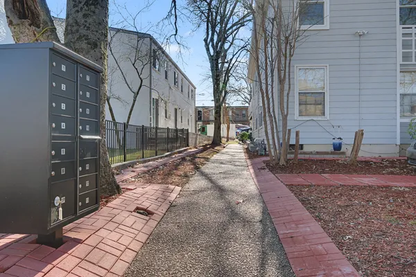 a view of a pathway with a house
