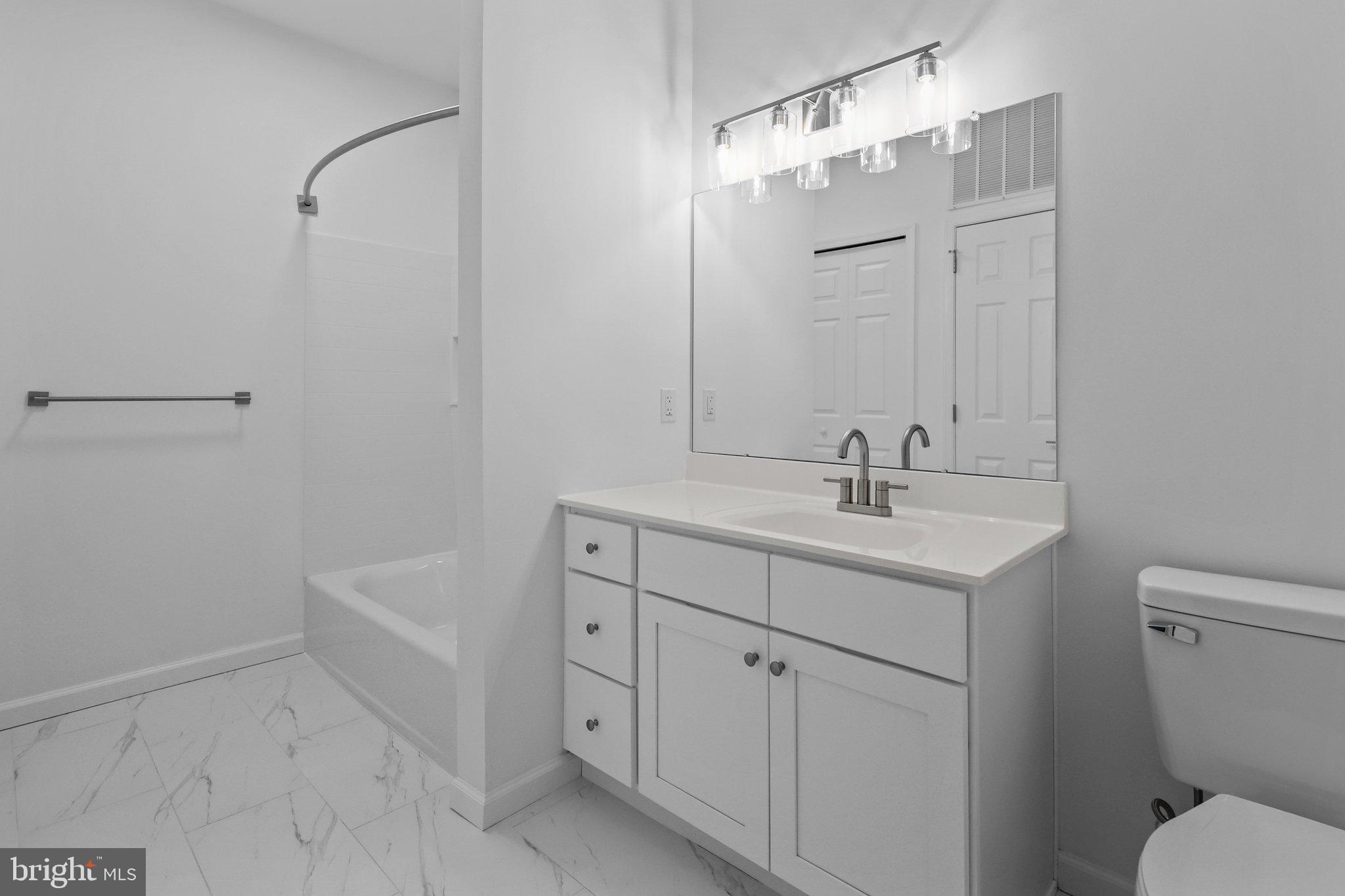 11112 Cornerstone Drive Yardley, PA 19067 - Photo 16 of 25 a bathroom with a sink a toilet and shower