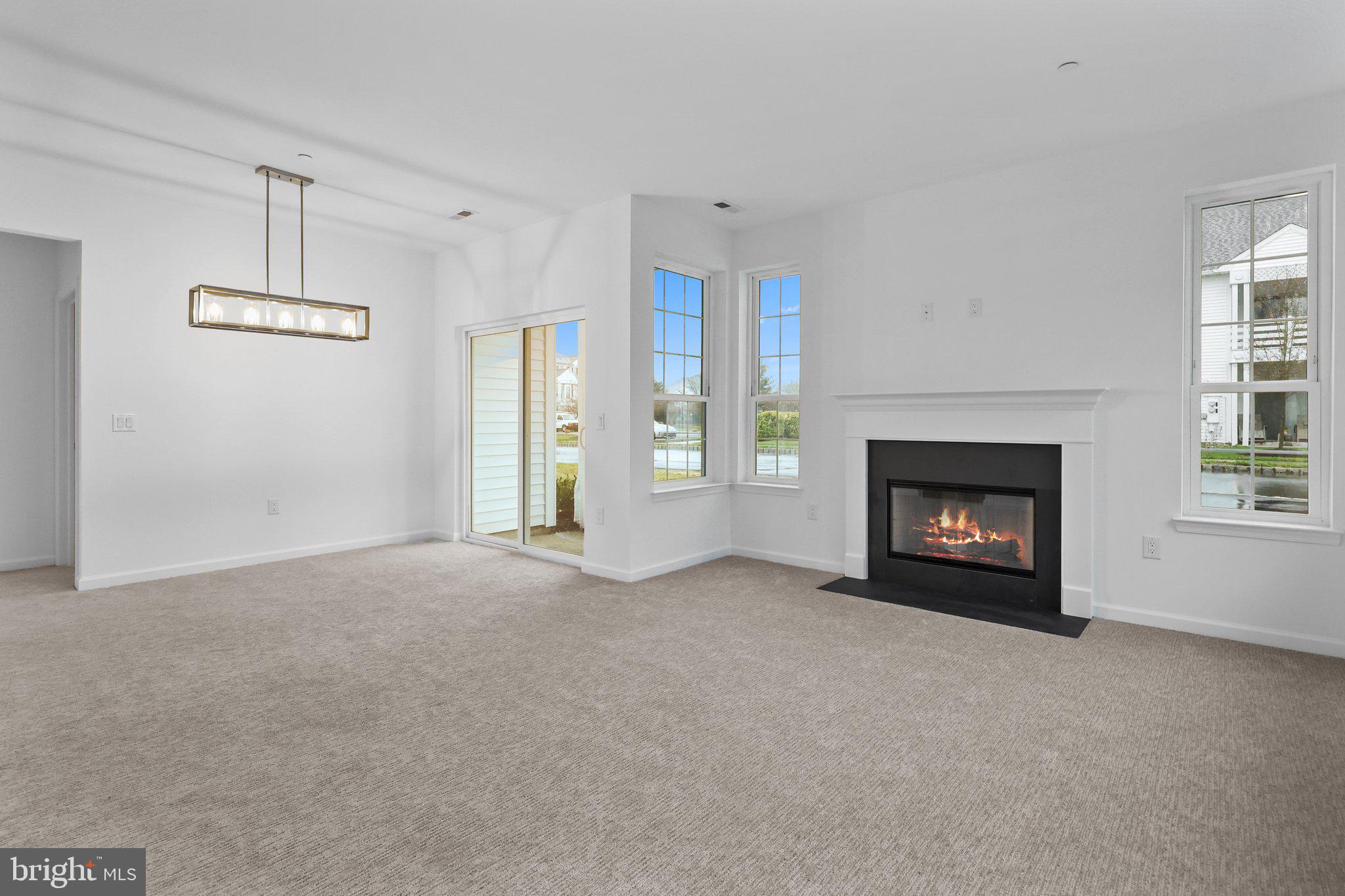 11112 Cornerstone Drive Yardley, PA 19067 - Photo 5 of 25 a view of an empty room with a fireplace and a window