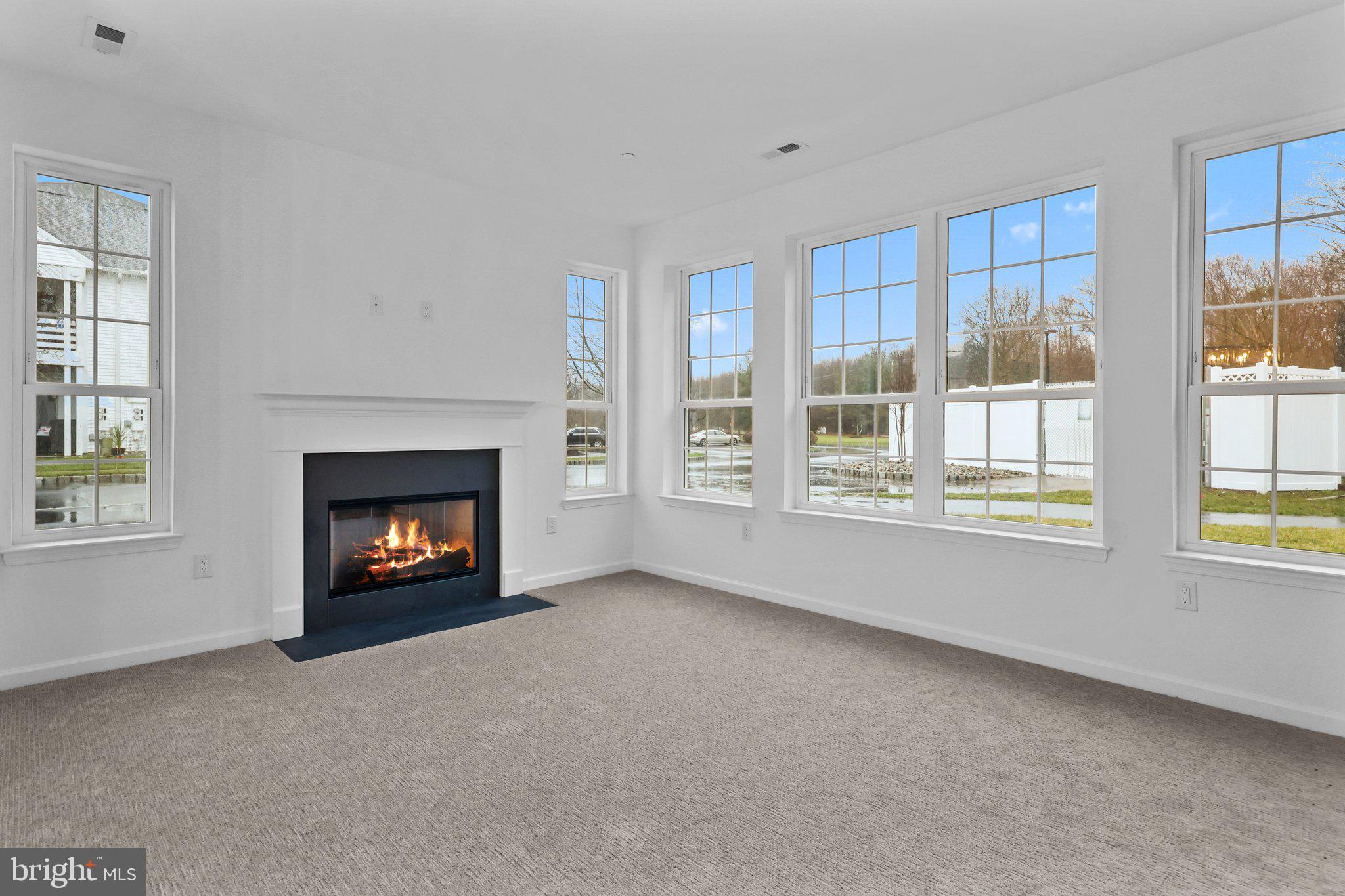 11112 Cornerstone Drive Yardley, PA 19067 - Photo 6 of 25 a view of an empty room with a fireplace and a window