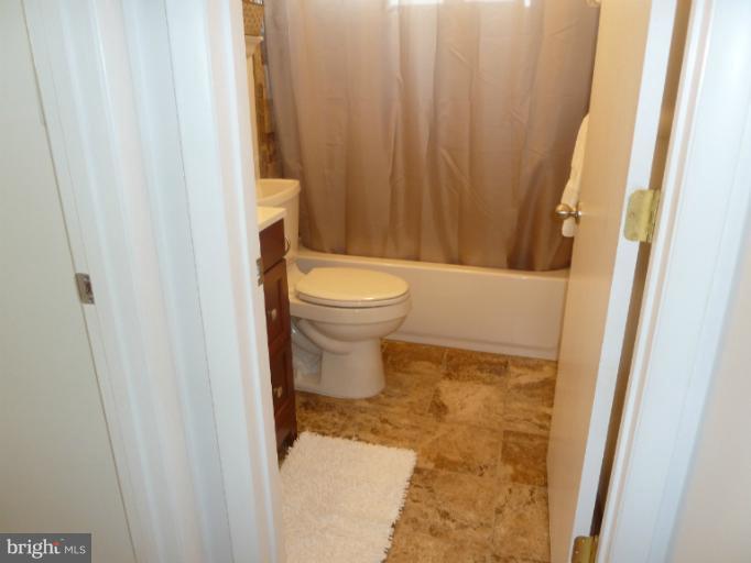 12908 Bluhill Road Silver Spring, MD 20906 - Photo 2 of 26 a bathroom with a toilet and a shower