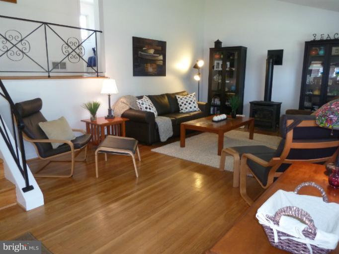 12908 Bluhill Road Silver Spring, MD 20906 - Photo 13 of 26 a living room with furniture and wooden floor