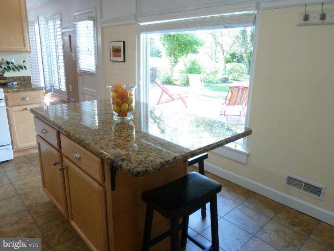 12908 Bluhill Road Silver Spring, MD 20906 - Photo 17 of 26 a view of kitchen island with furniture and window