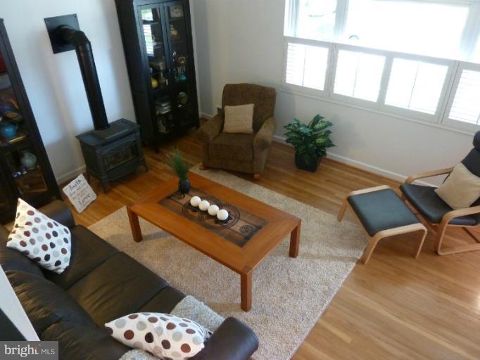 12908 Bluhill Road Silver Spring, MD 20906 - Photo 19 of 26 a living room with furniture and a mirror