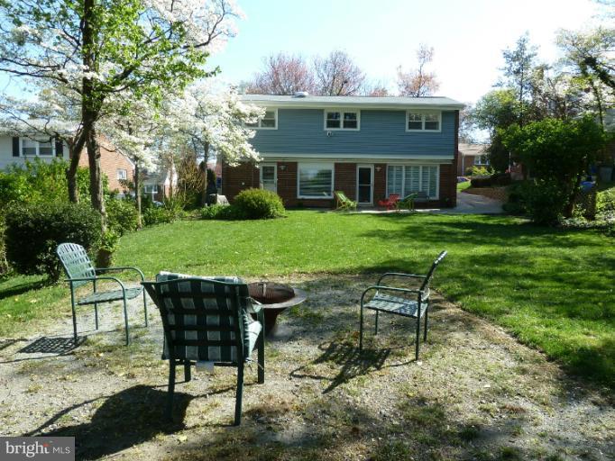 12908 Bluhill Road Silver Spring, MD 20906 - Photo 24 of 26 a view of a chairs and table in backyard