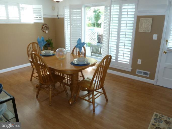 12908 Bluhill Road Silver Spring, MD 20906 - Photo 25 of 26 a view of a dining room with furniture and window