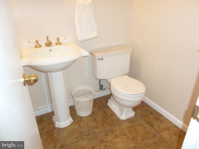 12908 Bluhill Road Silver Spring, MD 20906 - Photo 5 of 26 a bathroom with a sink and a toilet
