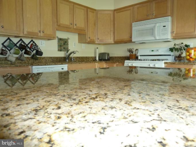 12908 Bluhill Road Silver Spring, MD 20906 - Photo 6 of 26 a kitchen with a sink and cabinets