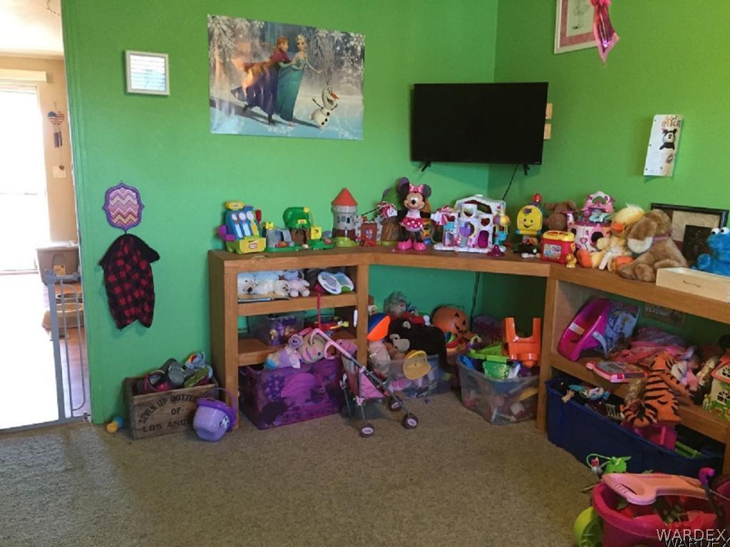 3995 Eloy Road, Unit 66 Golden Valley, AZ 86413 - Photo 19 of 27 a play room with toys