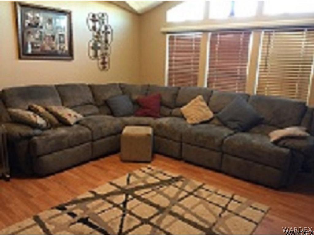 3995 Eloy Road, Unit 66 Golden Valley, AZ 86413 - Photo 5 of 27 a living room with furniture and a window
