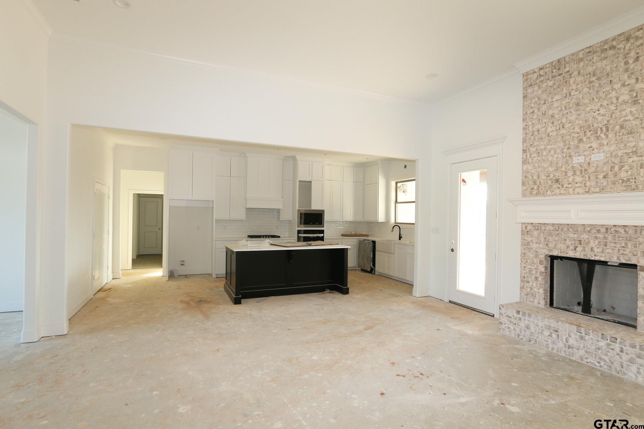 16503 Cooper Way Flint, TX 75762 - Photo 12 of 33 a living room with furniture and a fireplace