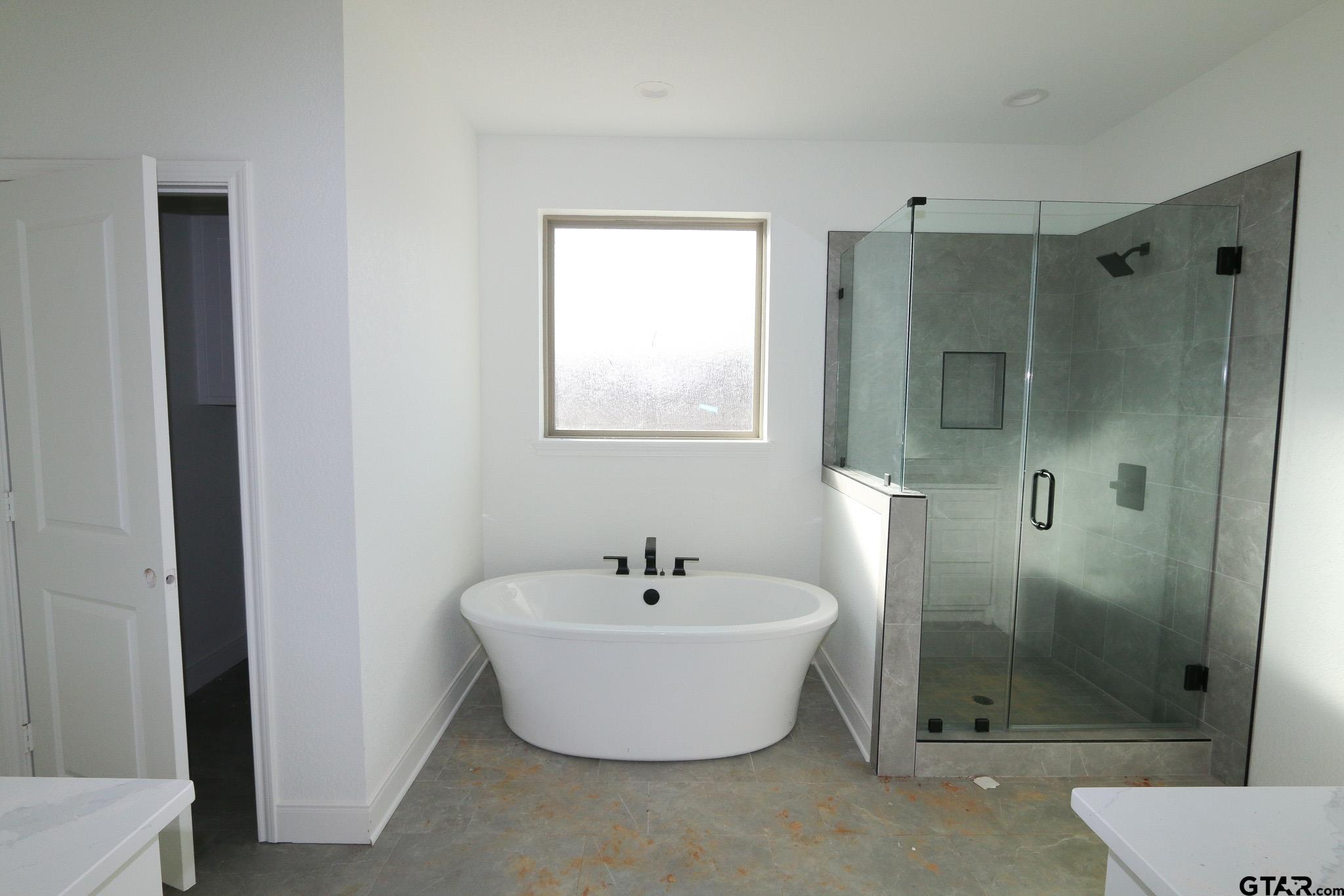 16503 Cooper Way Flint, TX 75762 - Photo 20 of 33 a white bath tub sitting next to a bathroom sink
