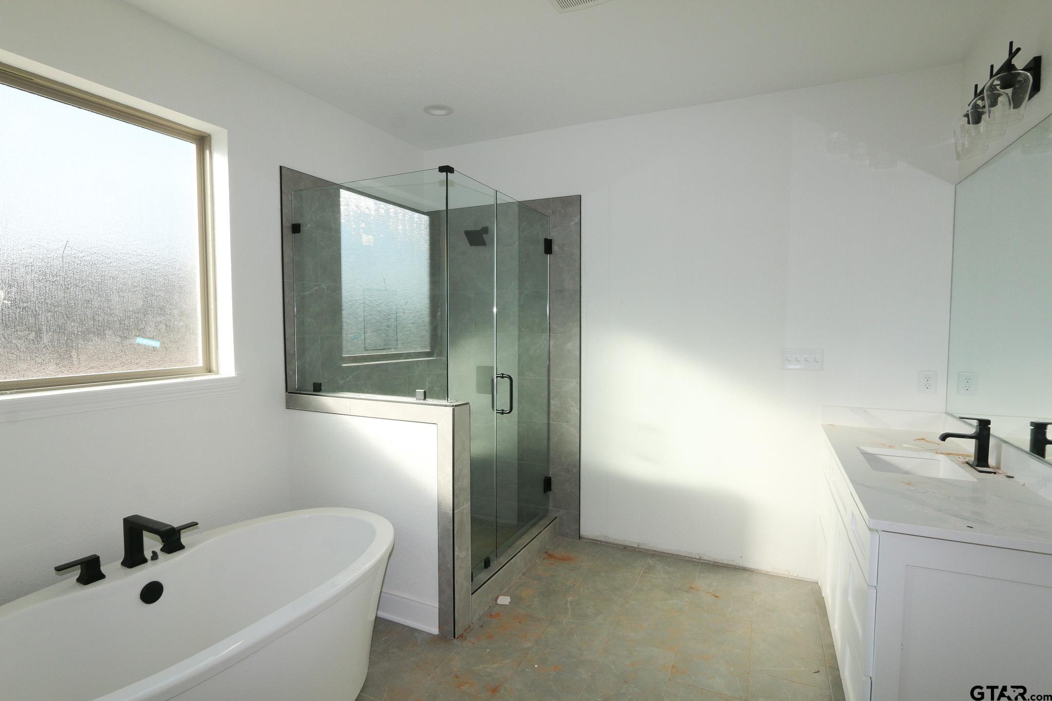16503 Cooper Way Flint, TX 75762 - Photo 21 of 33 a bathroom with a tub sink and mirror