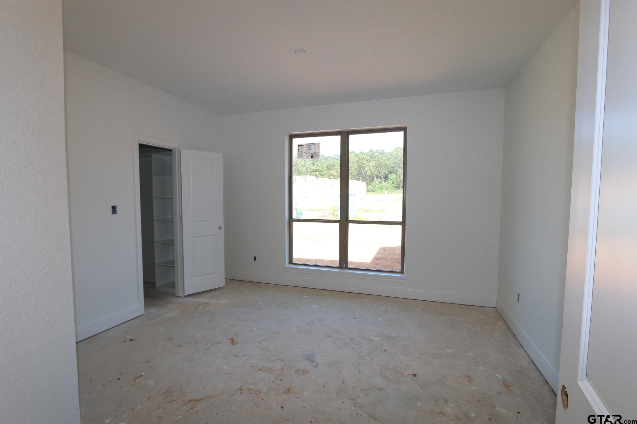 16503 Cooper Way Flint, TX 75762 - Photo 24 of 33 an empty room with a empty space and windows