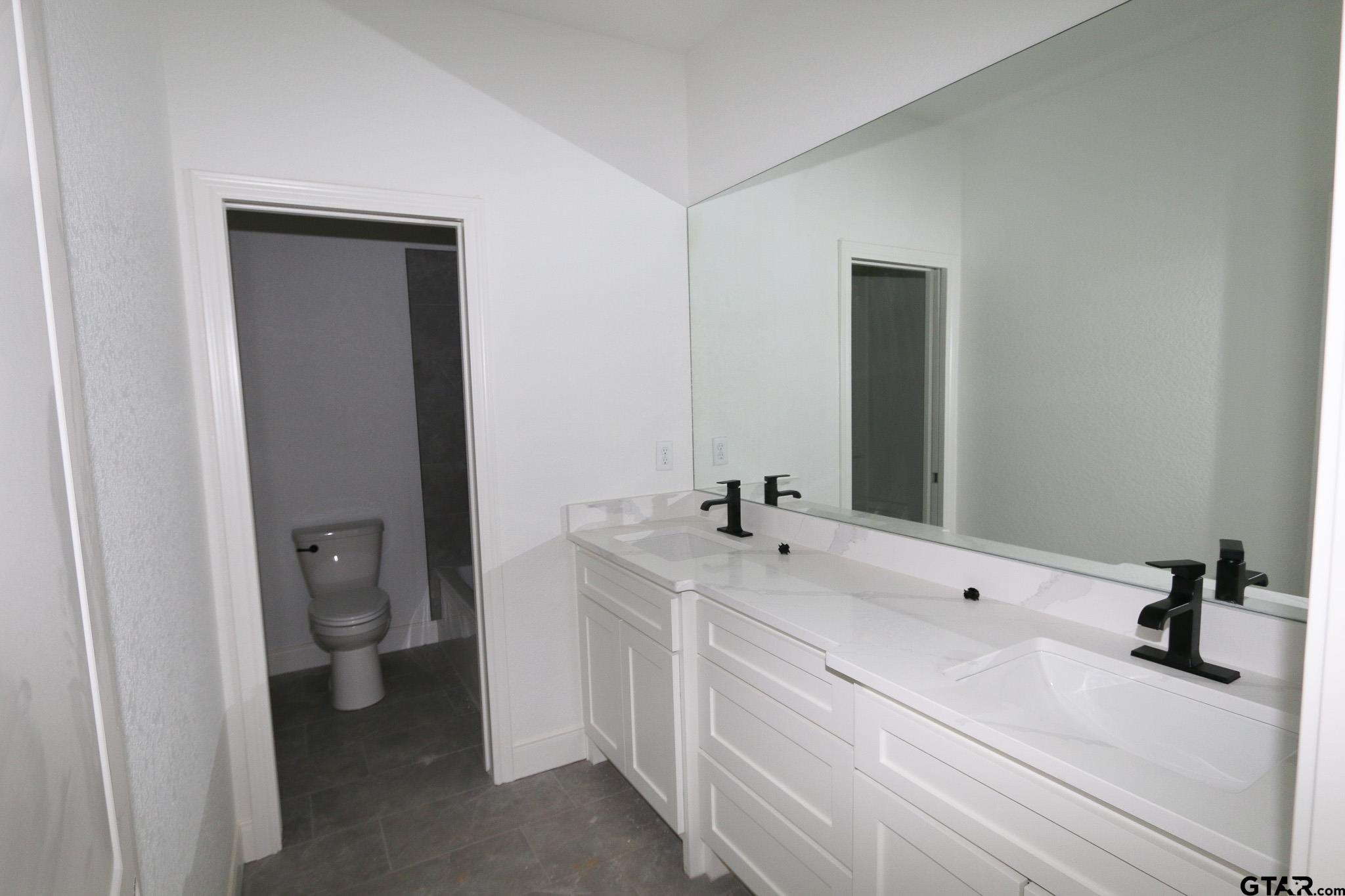 16503 Cooper Way Flint, TX 75762 - Photo 26 of 33 a bathroom with a sink and a mirror