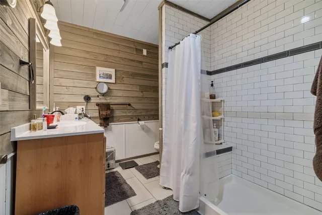 a bathroom with a sink and mirror