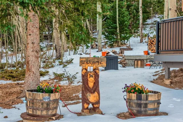 a view of a patio with table and chairs potted plants