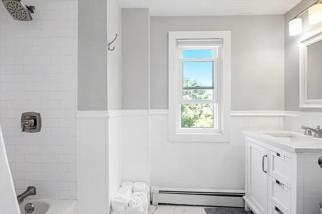 a bathroom with a sink toilet and vanity