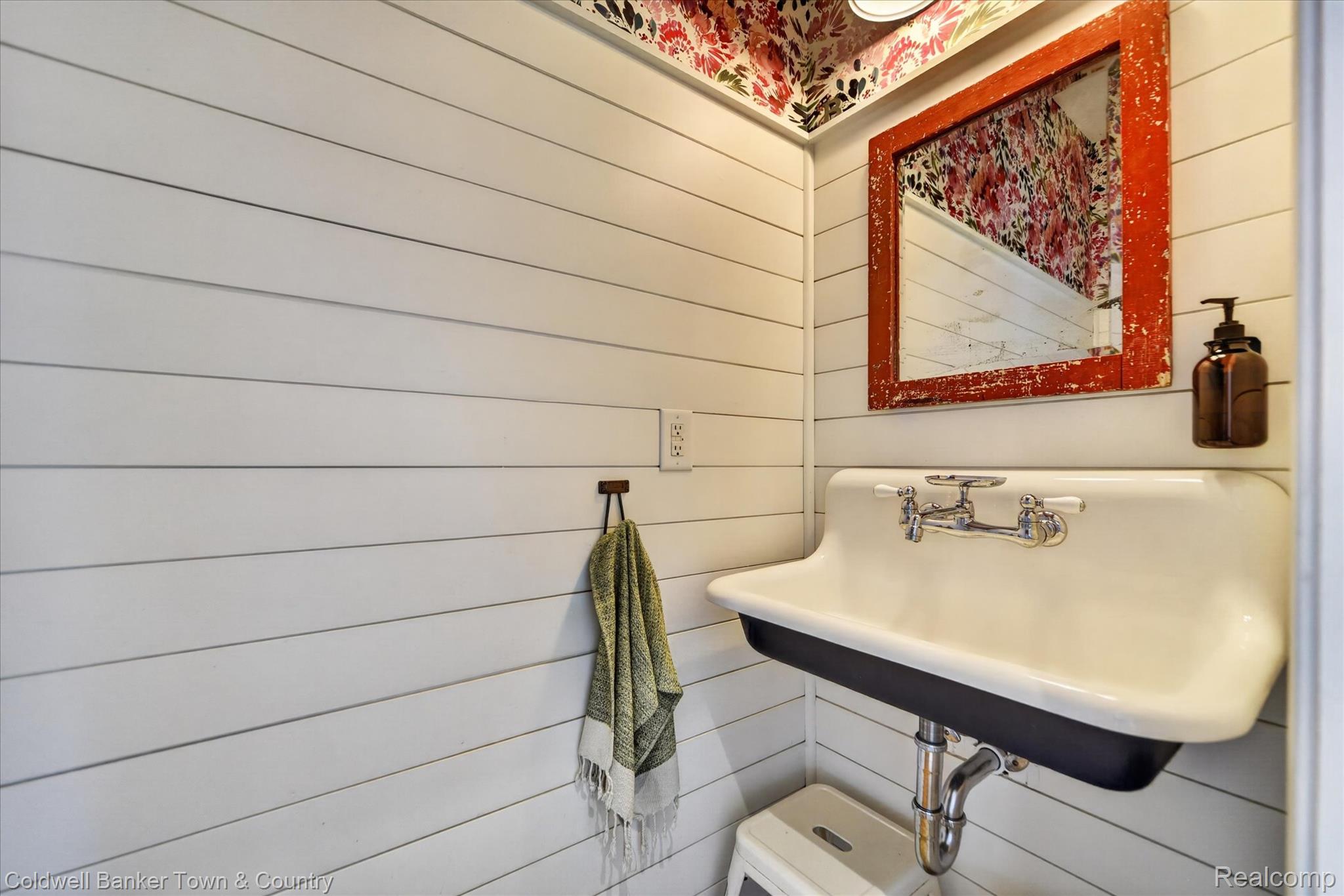 918 Gray Fox Court Howell, MI 48843 - Photo 22 of 84 Shiplap wall paneling complementing a wall-mounted sink with dual faucets