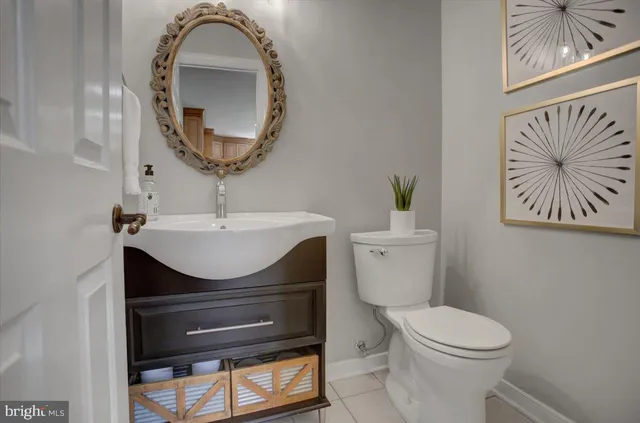 a bedroom with a bed and a flat tv screen on dresser
