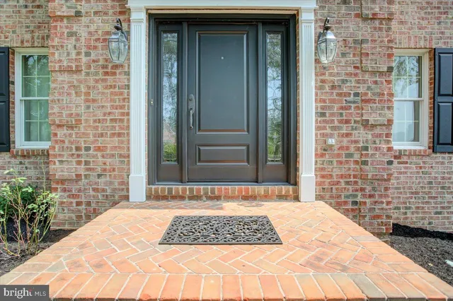 a view of an entryway with wooden floor and staircase