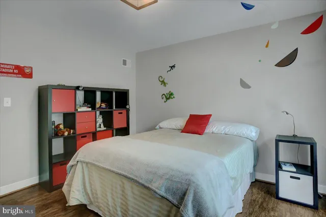 a view of a house with a yard and tree