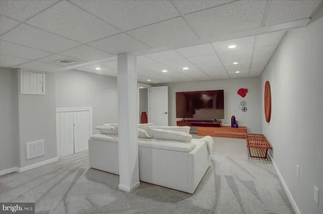 a view of a house with wooden deck