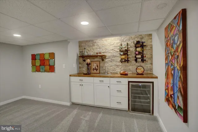 a view of a deck with two chairs and a yard