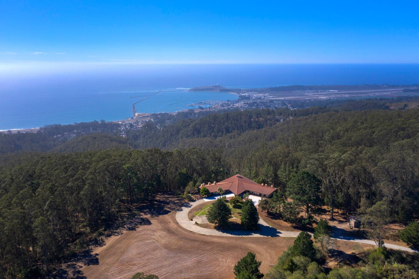 800 El Granada Boulevard El Granada, CA 94019 - Photo 2 of 57 a view of a lake in middle of the forest