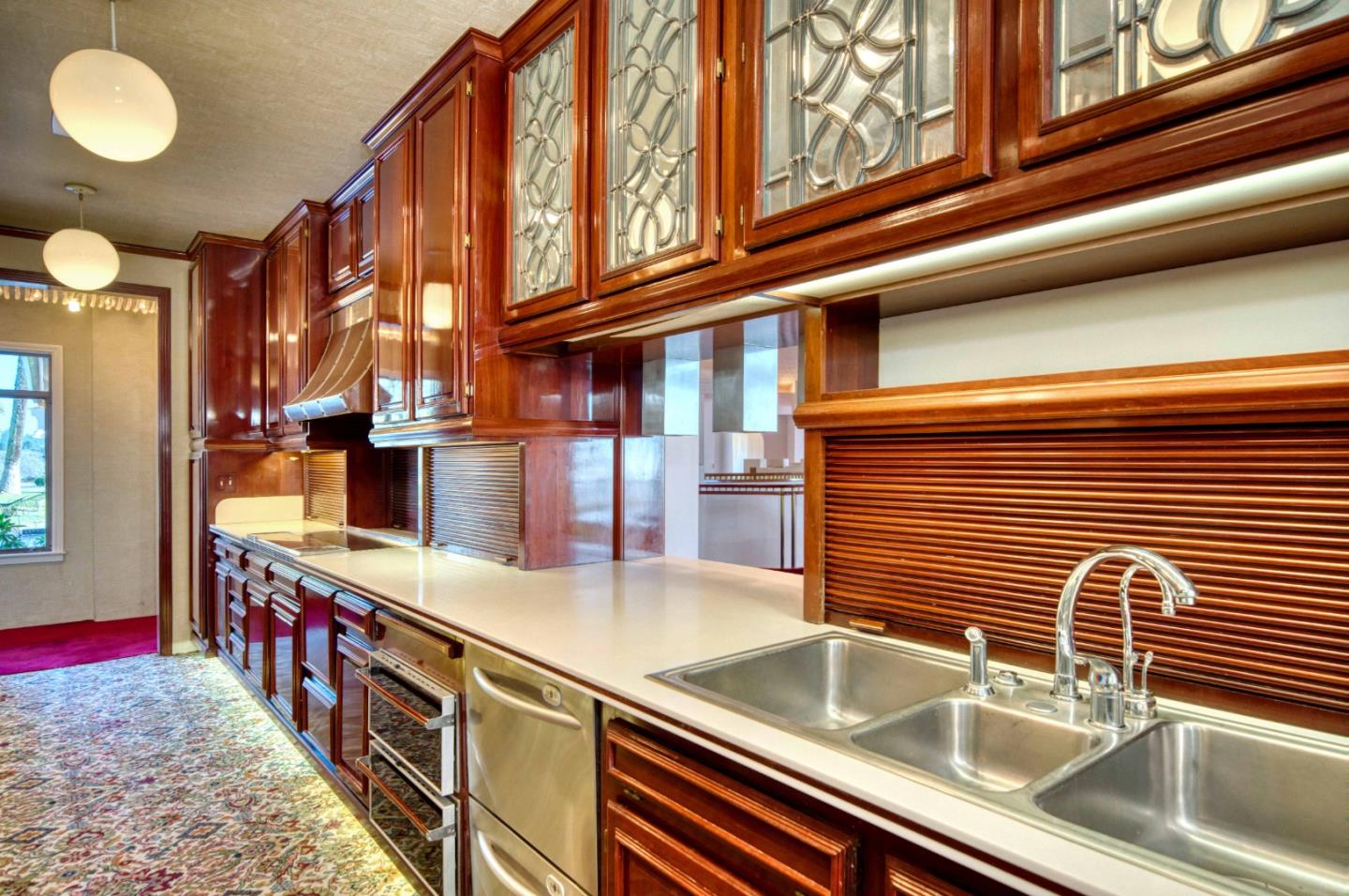 800 El Granada Boulevard El Granada, CA 94019 - Photo 20 of 57 a kitchen with stainless steel appliances a sink and cabinets
