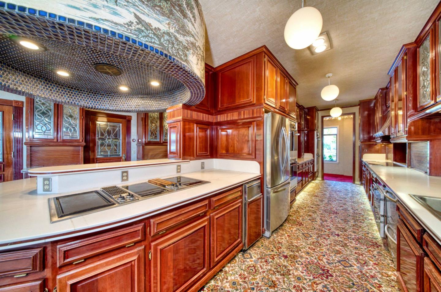 800 El Granada Boulevard El Granada, CA 94019 - Photo 21 of 57 a large kitchen with stainless steel appliances granite countertop a sink and cabinets