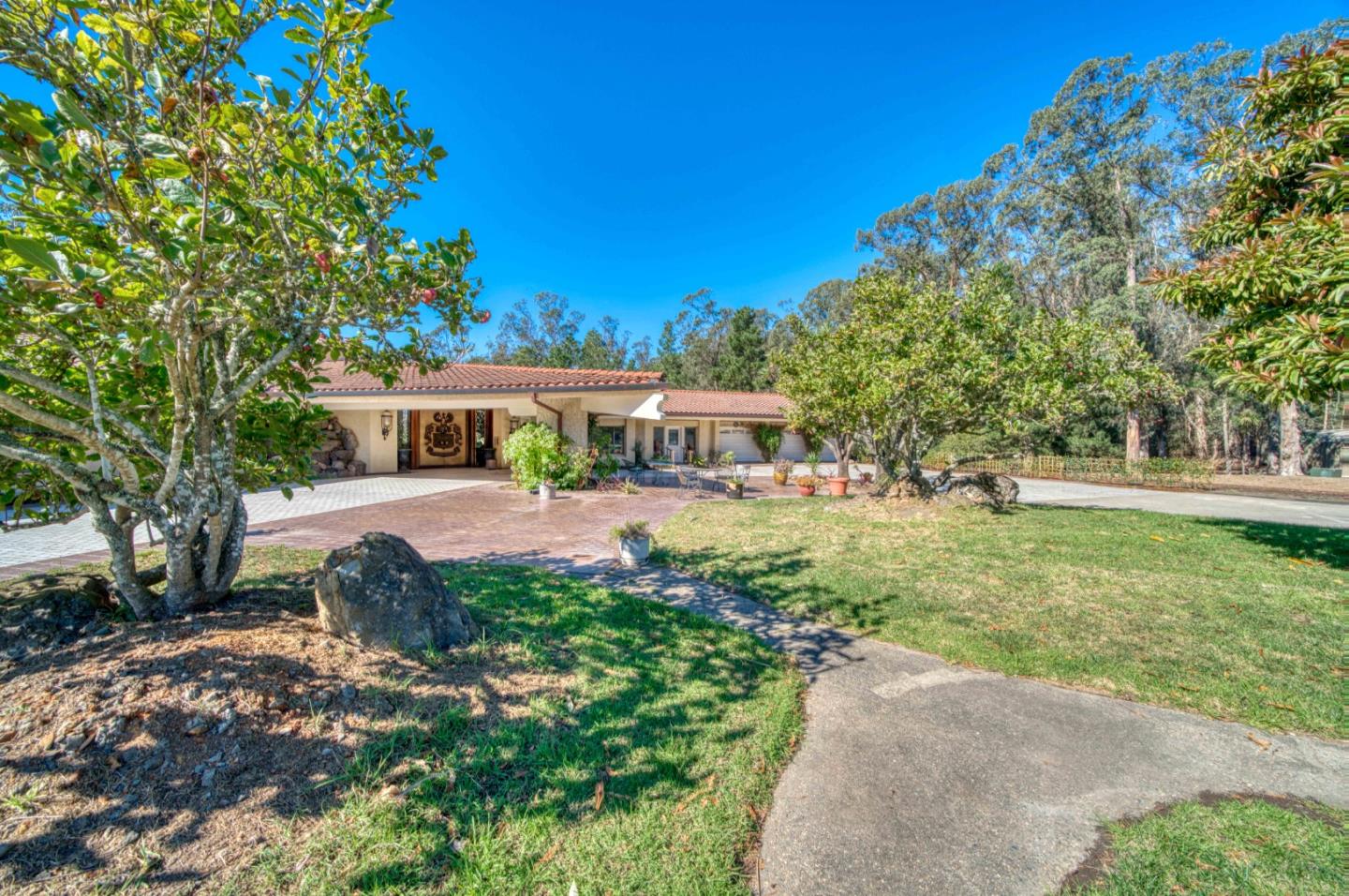 800 El Granada Boulevard El Granada, CA 94019 - Photo 4 of 57 a view of a house with garden and trees