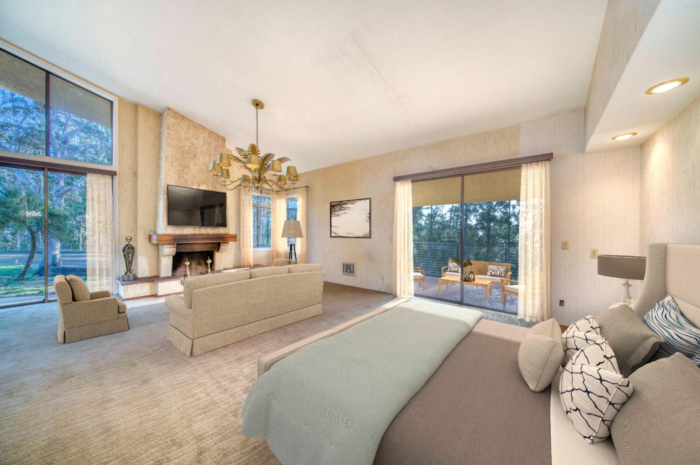 800 El Granada Boulevard El Granada, CA 94019 - Photo 32 of 57 a living room with furniture a flat screen tv and a chandelier