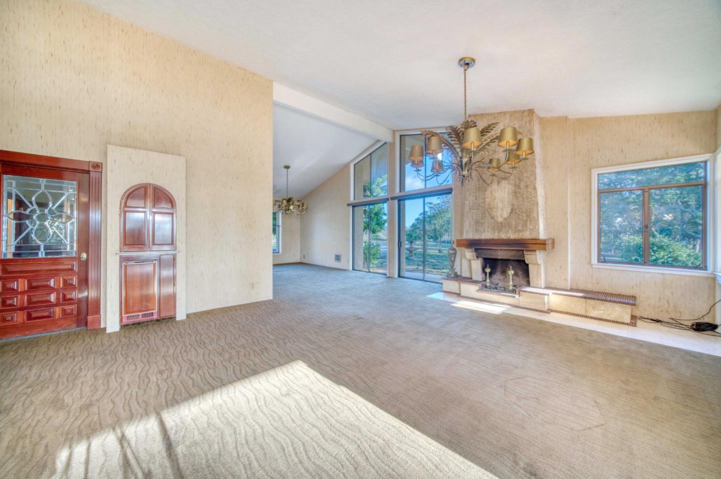 800 El Granada Boulevard El Granada, CA 94019 - Photo 36 of 57 a view of empty room with wooden floor and fireplace