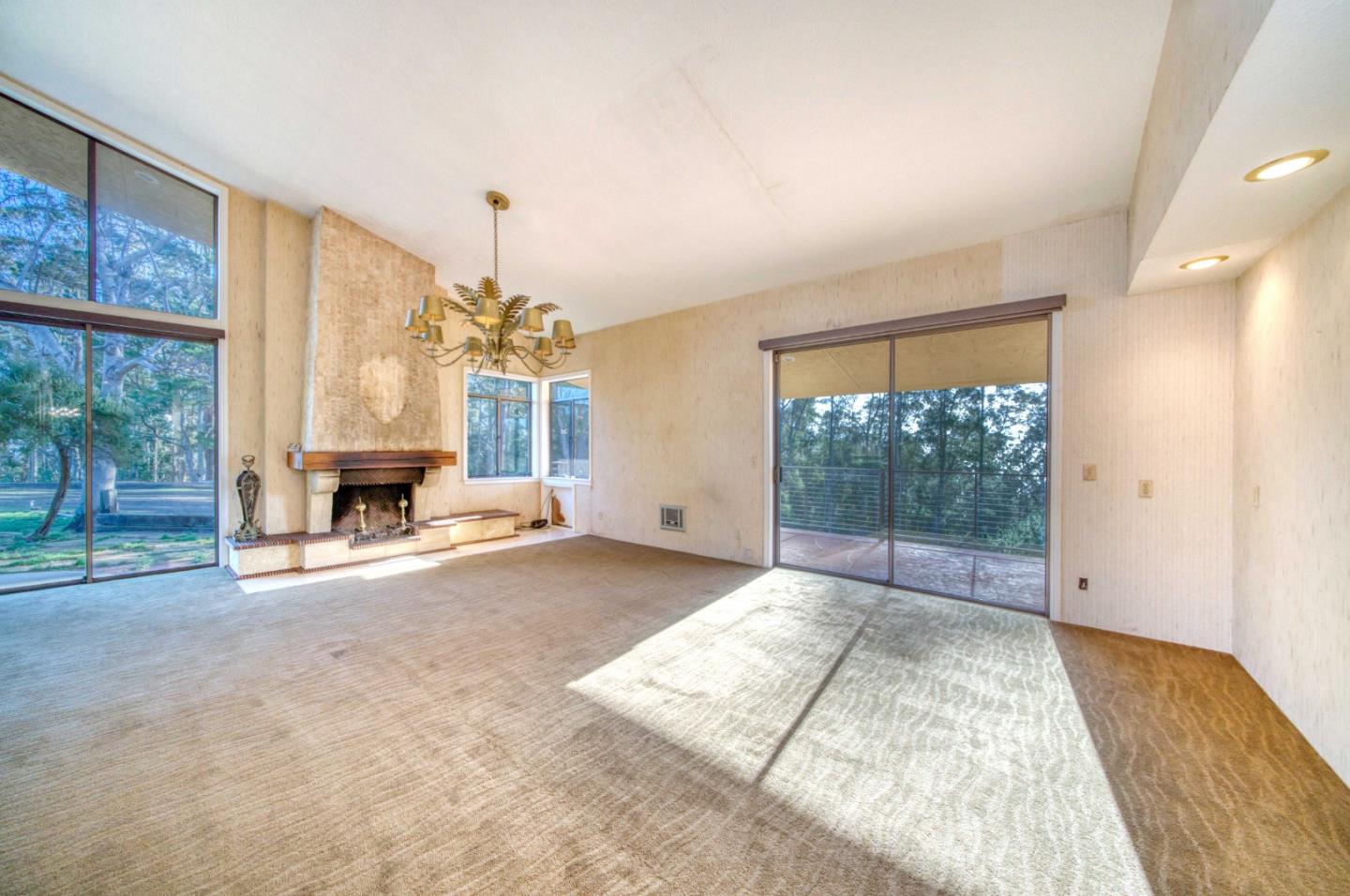 800 El Granada Boulevard El Granada, CA 94019 - Photo 37 of 57 a view of a room with wooden floor and fireplace