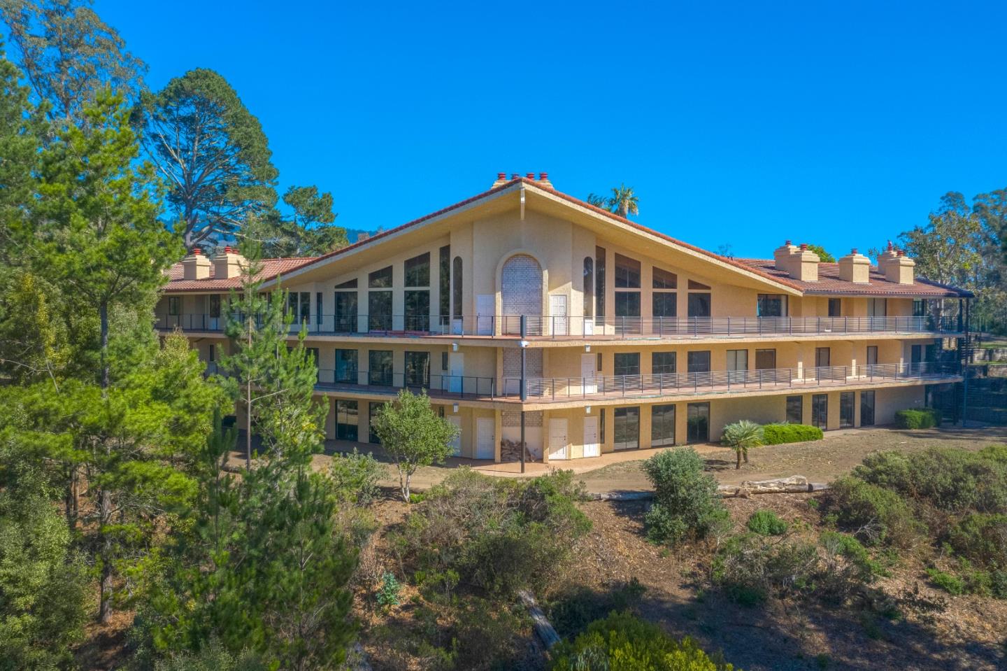 800 El Granada Boulevard El Granada, CA 94019 - Photo 54 of 57 a front view of a building with a garden
