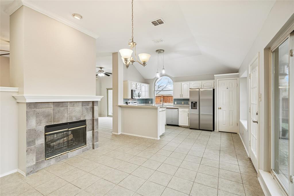 356 Arbor Court Euless, TX 76039 - Photo 10 of 37 Open kitchen with beautiful quartz countertops and subway tile backsplash