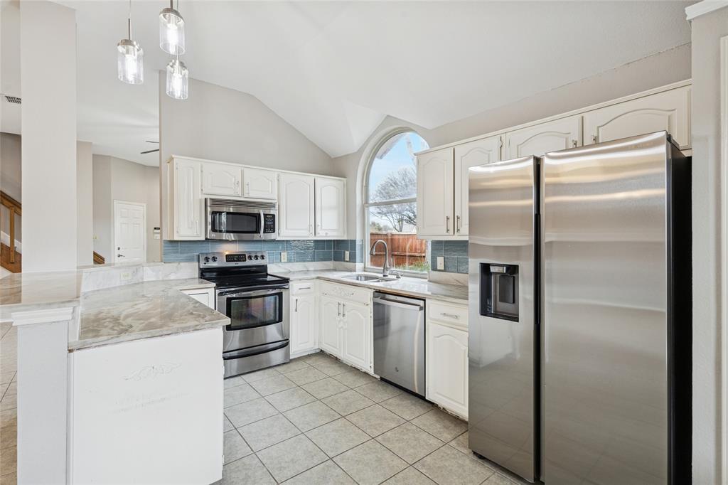 356 Arbor Court Euless, TX 76039 - Photo 14 of 37 Open light and bright kitchen ready for the gourmet chef in you!