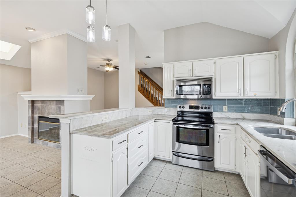356 Arbor Court Euless, TX 76039 - Photo 16 of 37 Open kitchen is perfect for interacting with family and guests while entertaining.