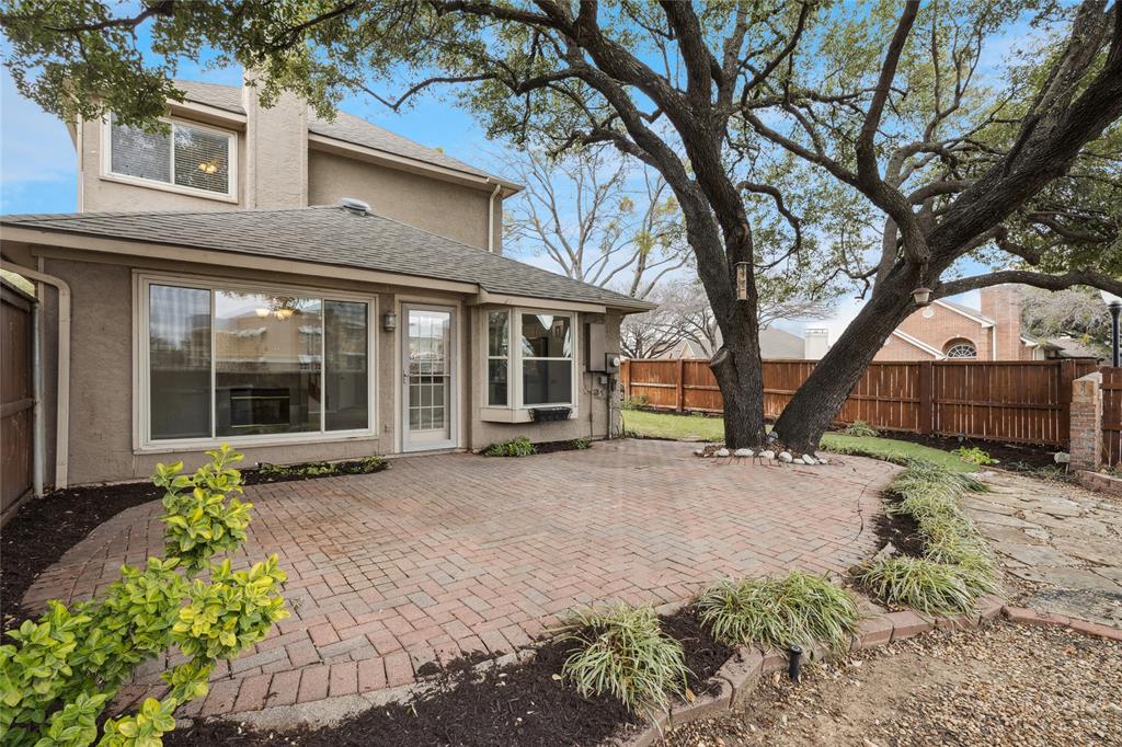 356 Arbor Court Euless, TX 76039 - Photo 29 of 37 View of the back of the house showing view of windows allowing lots of light