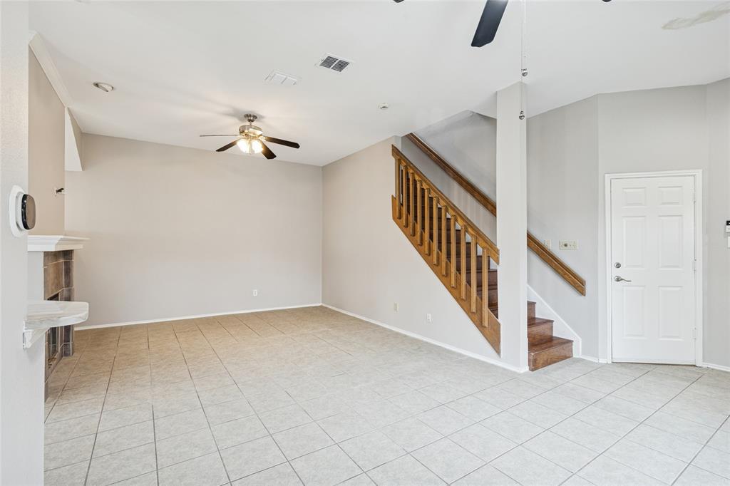 356 Arbor Court Euless, TX 76039 - Photo 4 of 37 Large living area with see through fireplace and wrap around mantle