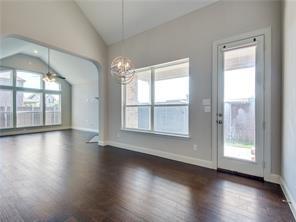 1121 Ranch Gate Lane Frisco, TX 75036 - Photo 5 of 13 a view of an empty room with wooden floor and a window