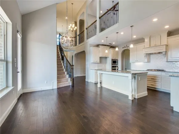a view of kitchen with cabinets and wooden floor